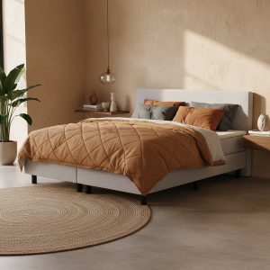 Boxspring grijs in een trendy slaapkamer met betonlook